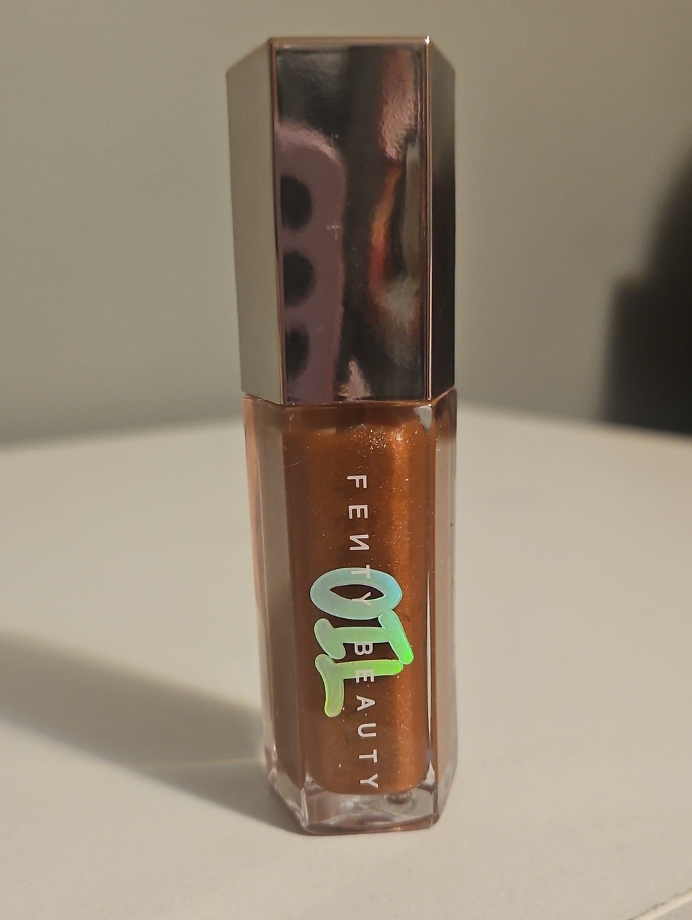 Fenty Beauty Shimmer Gloss in Metallic Bronze